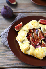 Tasty pie with figs on a plate