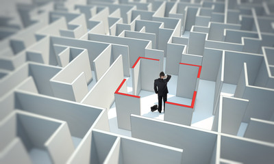 Businessman stands in center of maze. Make a difficult decision.