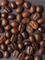 Coffee crop beans on wood texture background