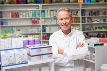 Senior pharmacist smiling at camera