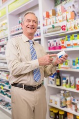 Smiling customer showing a medicine