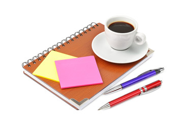 notebook and cup of coffee isolated on white background