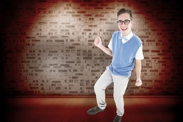 Composite image of geeky young hipster smiling at camera