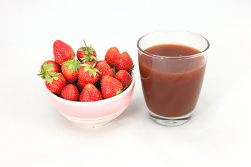 Small white bowl filled with red strawberries