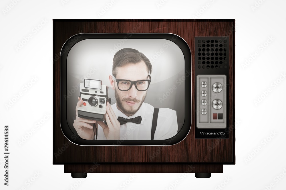 Aufkleber Composite image of geeky hipster holding a retro camera