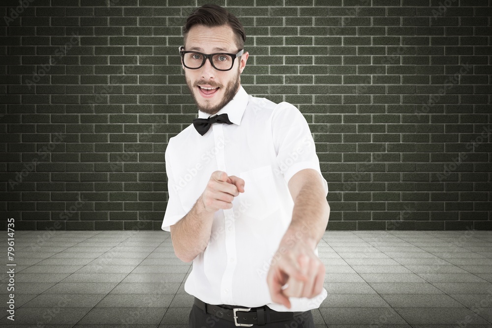 Aufkleber Composite image of geeky hipster pointing at camera