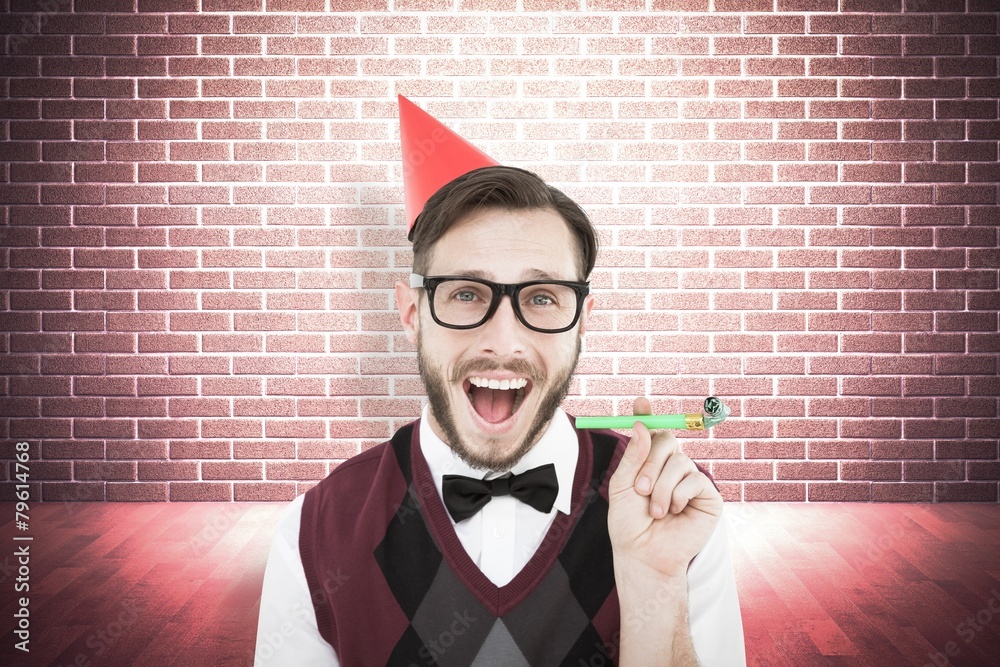 Poster Composite image of geeky hipster in party hat with horn