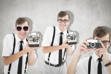 Composite image of geek with camera
