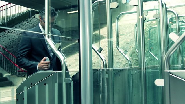 Commuter touching transport card on reader