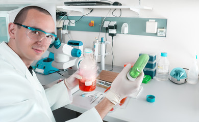 Young scientist works in modern laboratory