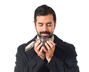 Man holding a jar glass with coffee inside