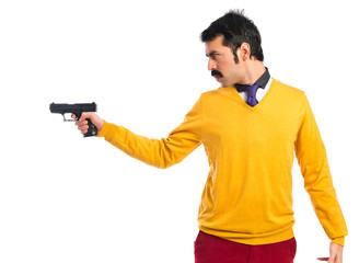 Man with moustache shooting with a pistol