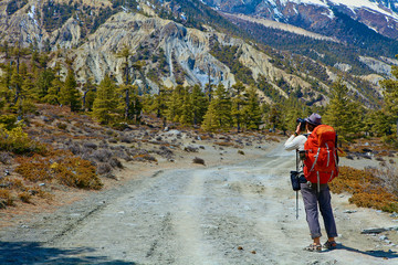 Hiking photographer taking pictures