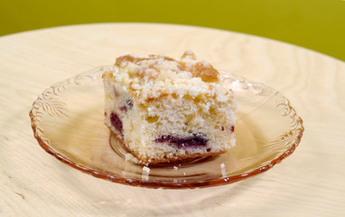 A portion of the yeast cake on a glass saucer.