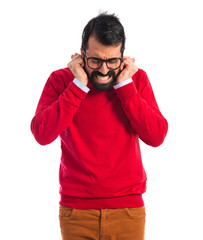 Hipster man covering his ears