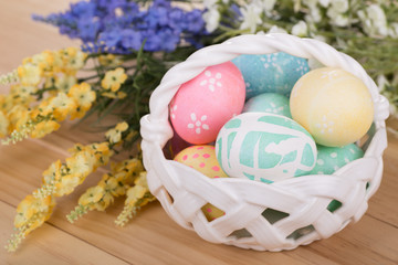 Basket of Easter Eggs with Flowers