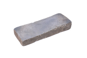 Sharpening or honing a knife on a waterstone, grindstone on the
