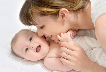 mother playing with baby