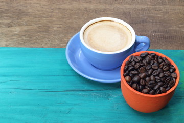 close up top view coffee cup on green wood background