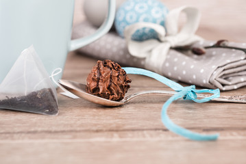 Choco9late truffle in a tea spoon