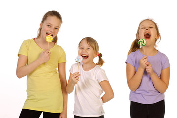 girls with lollipop on a white background 