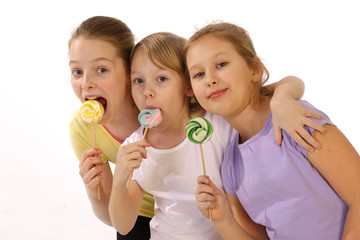 girls with lollipop on a white background 