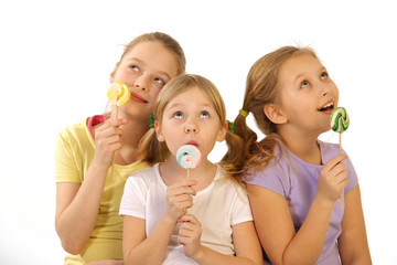 girls with lollipop on a white background 