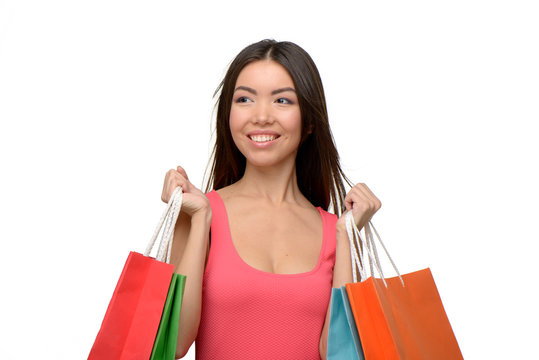 Asian young woman after shopping with bags