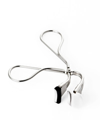 Eyelash curer on background