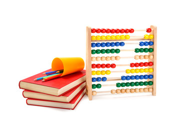 Colorful abacus, books and pencils on white background