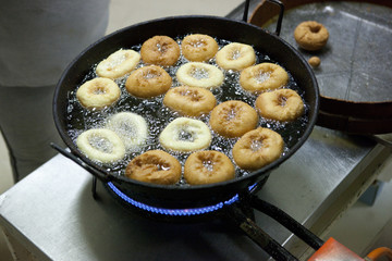 Spanish fried donuts in the pan