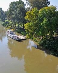 Fototapeta na wymiar Tourist boat on the river Tisza, near Tokaj city, Hungary