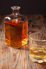 Bottle of whiskey and a glass