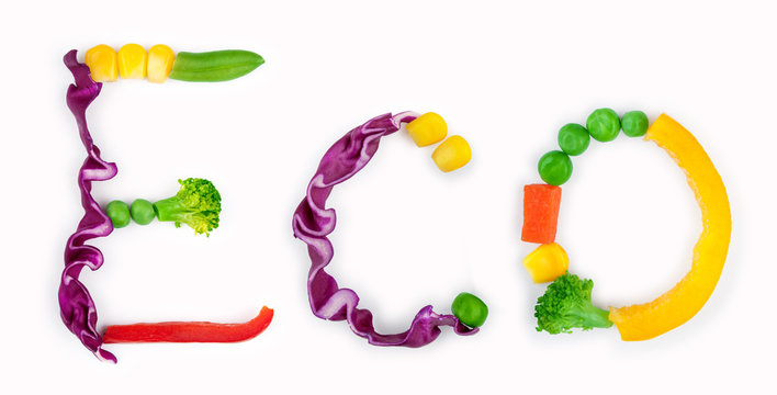 eco inscription from pieces of vegetables on white background