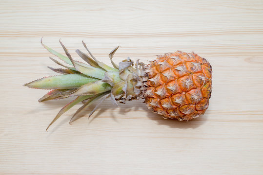 fresh pineapple on the wooden table