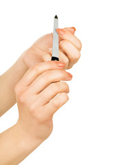 hands with nail file isolated on white