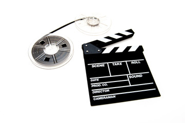 Vintage 8mm movie reels and clapper board white background