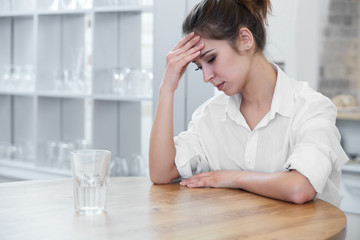 Portrait of woman with headache