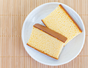 Close - up Sponge cake on white ceramic plate