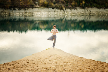 guy practices asanas on yoga in harmony with nature