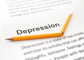 Paper with word depression and broken pencil