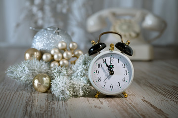Old alarm clock showing five to midnight. Happy New Year!