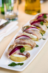 Restourant serving dish - pieces herring for snack