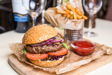 Restourant serving dish - burger with cutlet with frying potato