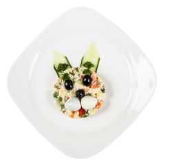 Restourant serving dish for child`s menu - salad with rabbit fac