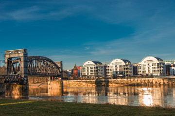 Fototapeta premium Early morning at new buildings and an old bridge in Magdeburg, G