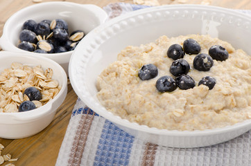 Bowl of oatmeal with fresh blueberries. Healthy breakfast