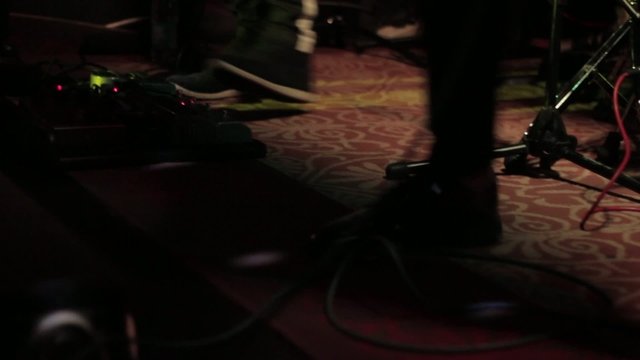 Singer's Particular Shoes During A Gig