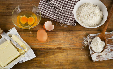 baking ingredients  on old wooden background