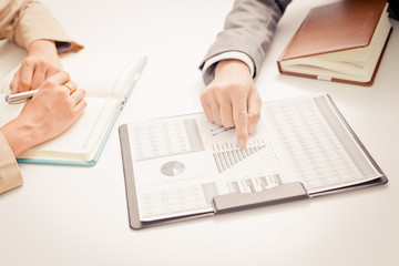 Business people discussing the charts and graphs showing the res